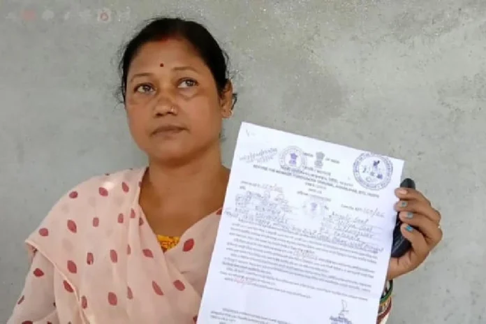 Anjali Seal on Friday shows the notice issued by the foreigners' tribunal in Assam/The Telegraph