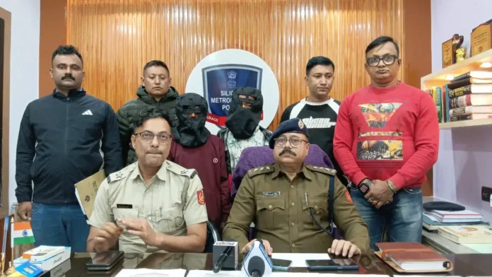 ACP Somnath Das briefs the press at Siliguri Police Station while the two arrested accused in the Milan Pally burglary case are produced before the media.
