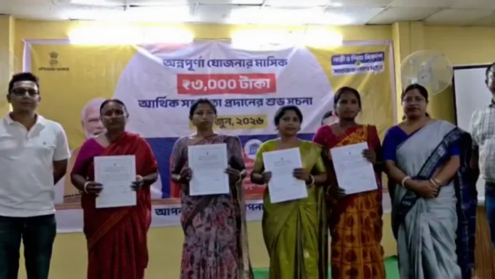 Beneficiaries receive approval letters under the Annapurna Yojana during a programme organised by the Rajganj Block Administration at the BDO office on Wednesday. 03 June 2026.